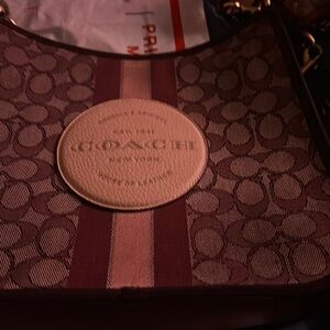 Crossbody burgundy and a light pink color used maybe 3 times very cd